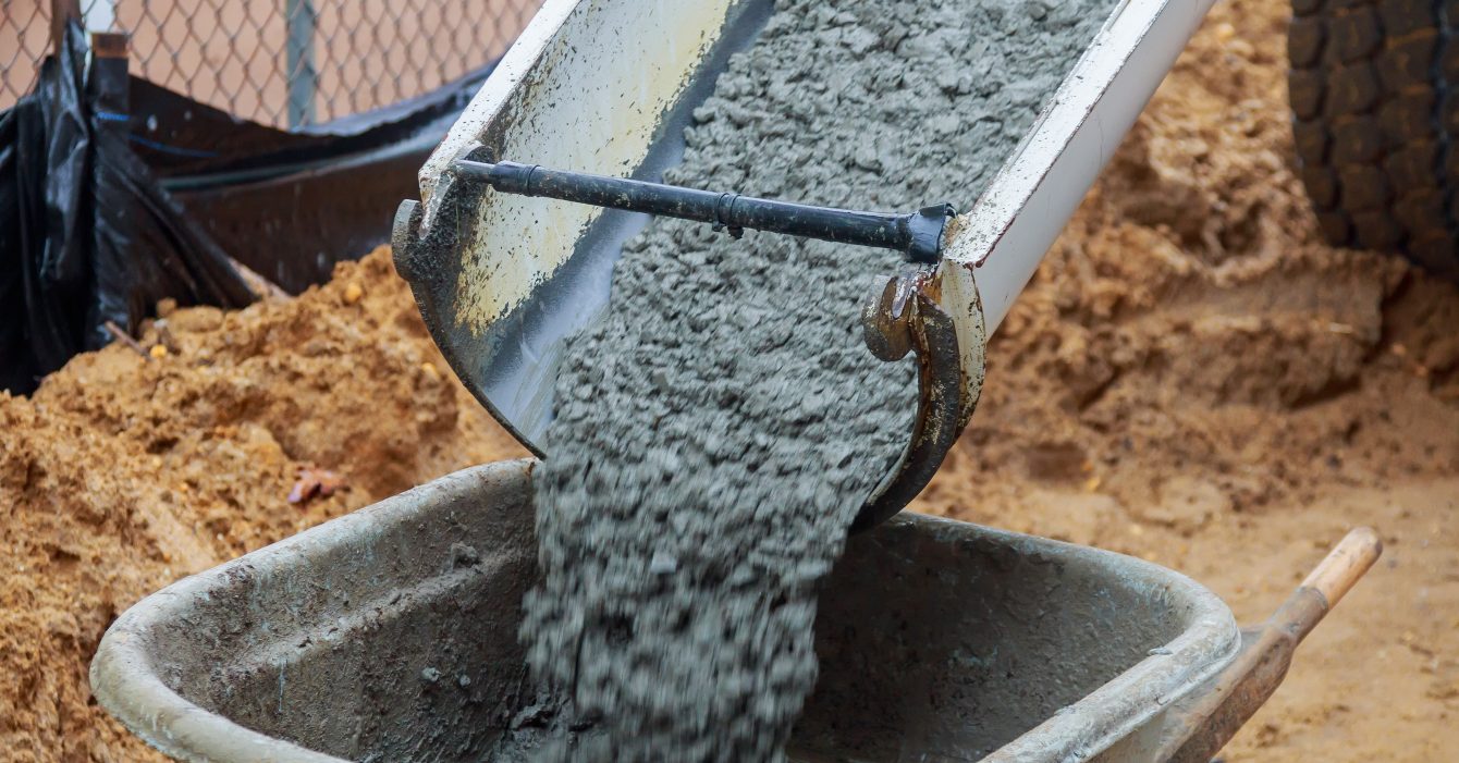 Wheelbarrow with shovel full of cement